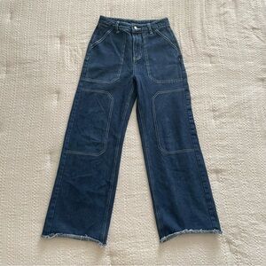 Blue cargo style baggy jeans with white stitching
